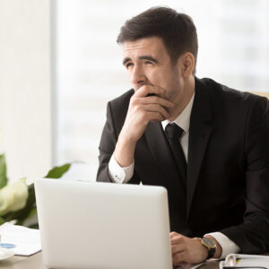 man yawning in office